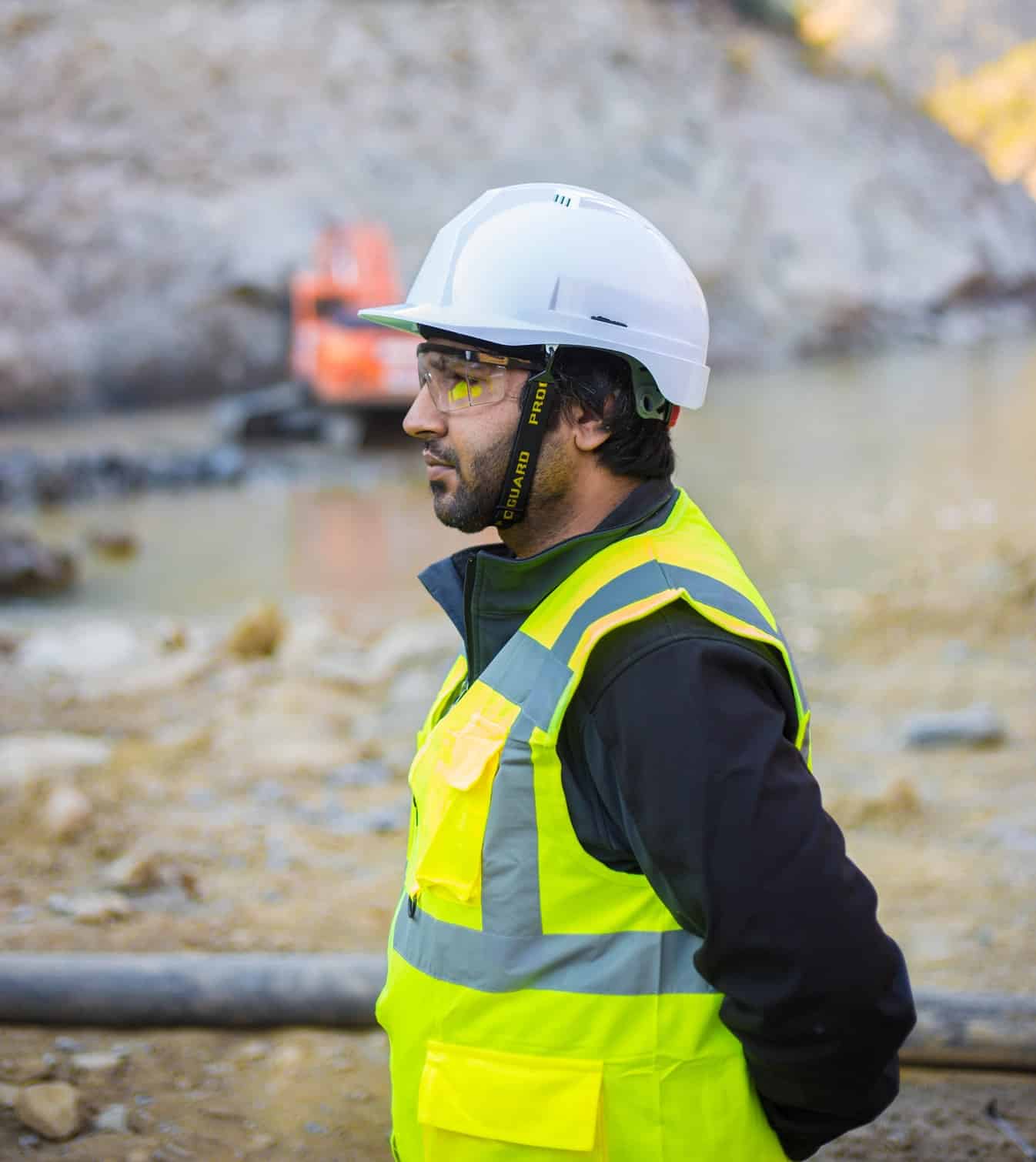 Construction worker wearing protective equipment and safety glasses