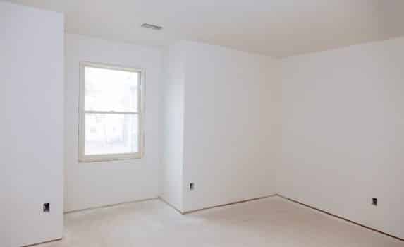 Interior construction of housing of empty apartment with white wall