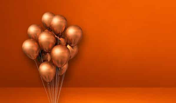 Copper balloons bunch on orange wall background. Horizontal banner. 3d illustration render