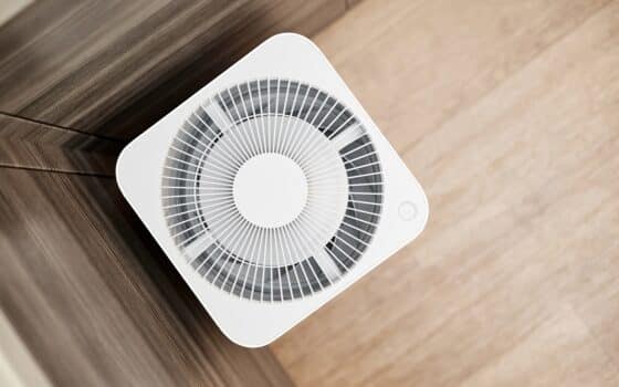 White air purifier in the kitchen of the apartment. Close-up, selective focus