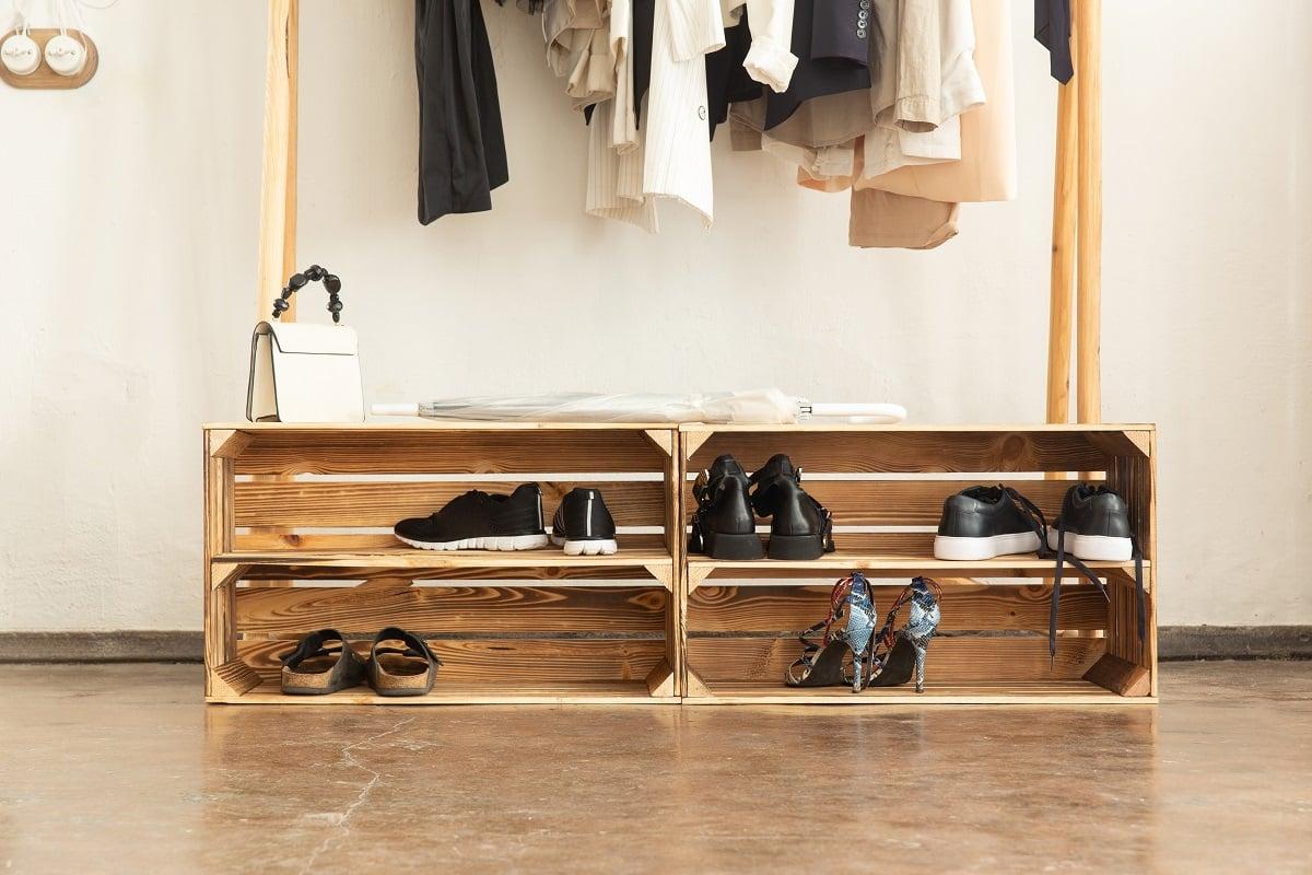 A rack of boxes made of burnt wood. Shelves for shoes in the loft style or scandinavia. Trend elements of the interior.