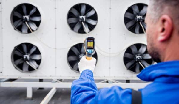 Technician uses a thermal imaging infrared thermometer to check the condensing unit heat exchanger. Cost of a thermal camera.