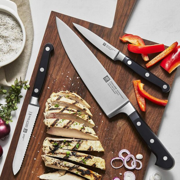 Henckels knives on a wood cutting board