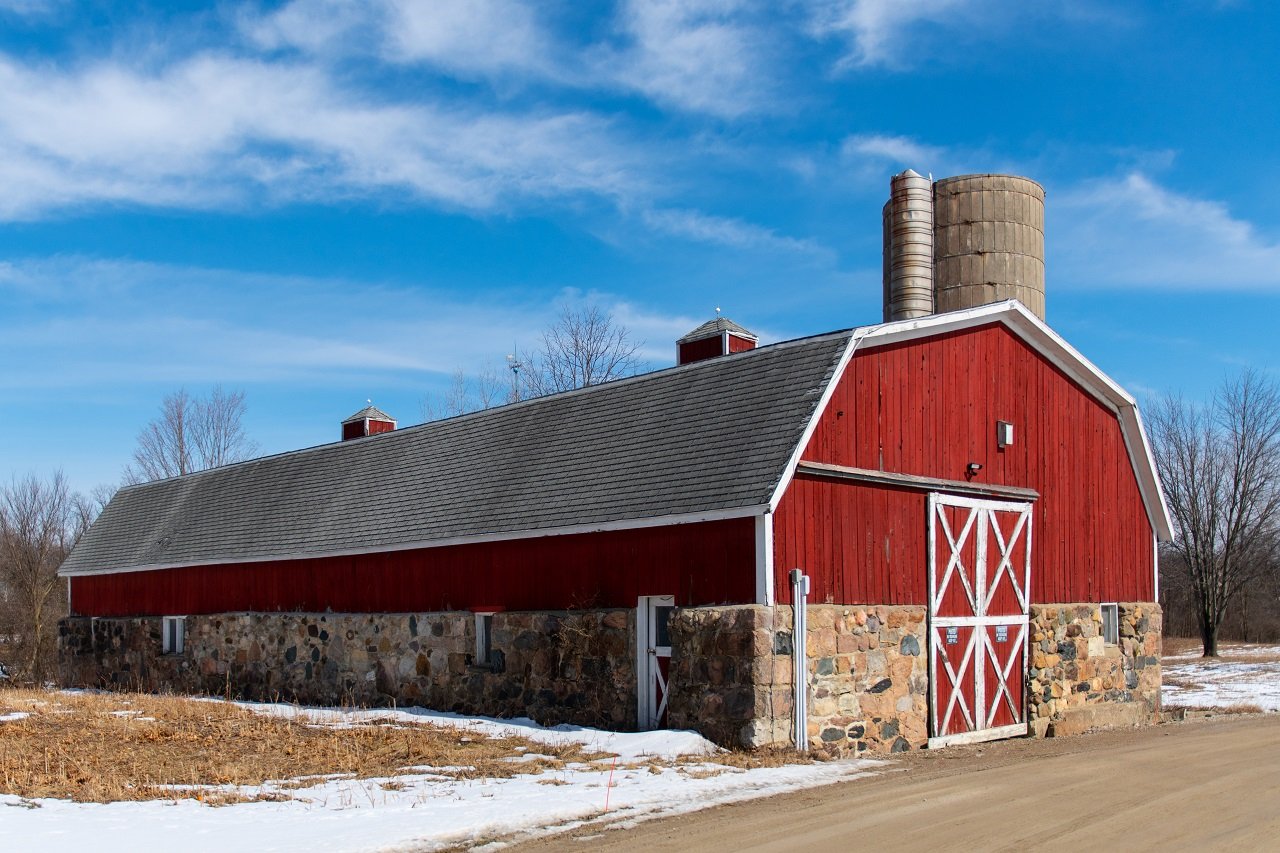 A beautiful shot of a store building from wood and stones of west bloomfield, mi. Mansard sheds.