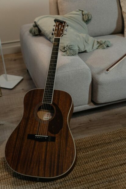 Guitar lay on a couch and rubber floor underlayment